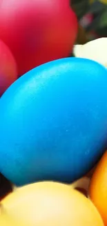 Close-up of colorful Easter eggs with blue, red, and yellow highlights.