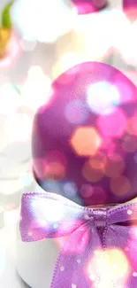 Purple Easter egg with ribbon and bokeh lights.