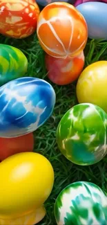 Colorful Easter eggs on green grass.