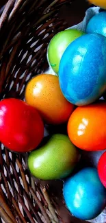 Colorful Easter eggs in a wicker basket creating a vibrant mobile wallpaper.