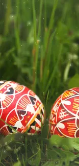 Colorful Easter eggs on green grass with intricate red patterns.