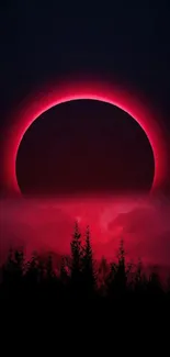 Red and black eclipse with tree silhouette at night.