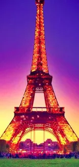 Stunning Eiffel Tower at sunset with vibrant purple and orange sky.