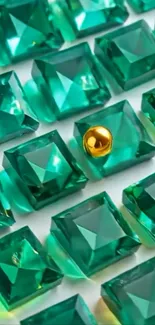 Emerald gemstones with a golden sphere amid geometric pattern.
