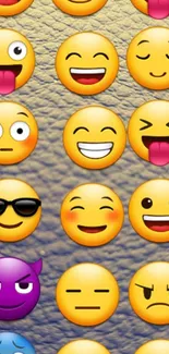 Colorful emoji wallpaper with smiley faces on a textured background.