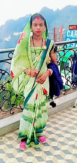 Woman in traditional attire with a scenic hill view.