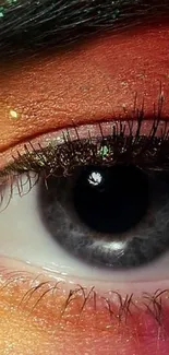 Close-up of an eye with vibrant colors in a mobile wallpaper.