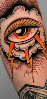 Eye tattoo with clouds and orange lightning on skin.