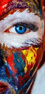 Colorful painted face with blue eye close-up.