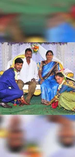 Family in colorful traditional attire at a festive event.