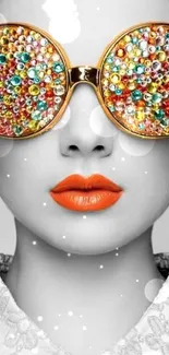 Portrait with jeweled sunglasses and orange lips on a grayscale background.