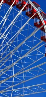 Ferris wheel against a bright blue sky.