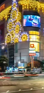 Festive city lights on building during night.