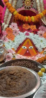 Colorful festive floral arrangement with traditional offerings.