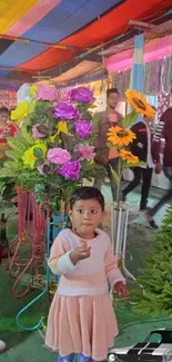 Festive market scene with decorations and a cheerful child.