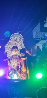 Colorful festival scene with illuminated performers at night.