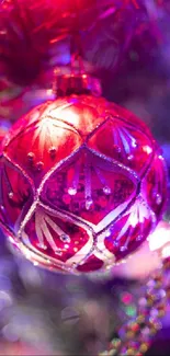 Close-up of a red ornament amid festive lights.