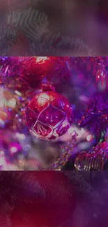 A vibrant purple Christmas ornament on a decorated festive tree.