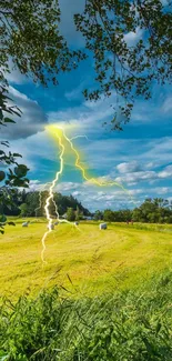 Dynamic lightning strike over a lush green field with a bright blue sky.