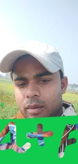 Selfie in a green field with clear sky.