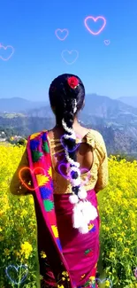 Woman in vibrant field with colorful hearts and traditional attire.