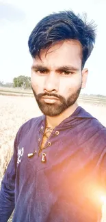 Stylish portrait in vibrant field during sunrise backdrop.