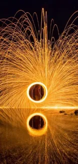 Fiery light art with reflection in water, mesmerizing night display.