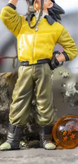 Anime figure in a yellow jacket with dragon ball.