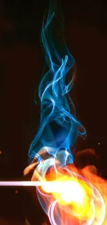 Vivid orange flame with swirling blue smoke on a dark background.