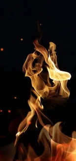 Dancing flames in the dark mobile wallpaper.