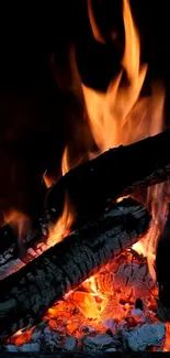 Captivating mobile wallpaper of glowing fire flames and burning logs.