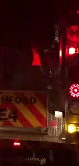 Firetruck with vibrant lights at night