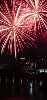 Colorful fireworks light up city skyline at night.