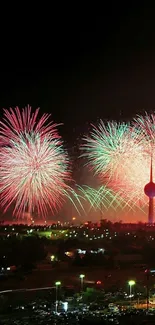 Colorful fireworks explode over city skyline at night.