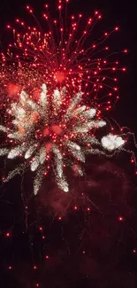 Red fireworks exploding in a dark sky.