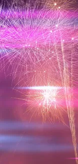 Purple and pink fireworks illuminating the night sky.