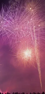 Dazzling fireworks display lighting up the night sky in vibrant purple hues.