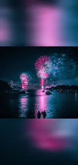 Vibrant fireworks illuminate a night sky over a city river.