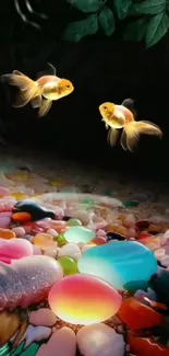 Goldfish swim above colorful stones in vibrant mobile wallpaper.