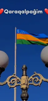 Vibrant flag with vintage lamp posts against blue sky.