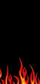 Fiery red and yellow flames on a black mobile wallpaper background.