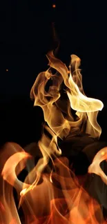 Mobile wallpaper featuring vibrant flames on a dark background.