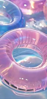 Vibrant pink and blue rings floating on water.