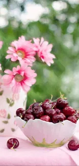 Pink flowers and fresh cherries in a decorative setting for wallpaper.