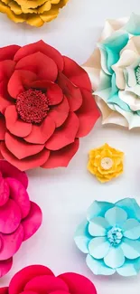 Vibrant colored paper flowers in red, blue, and yellow on a phone wallpaper.