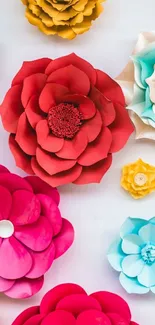 Colorful paper flowers on white background.