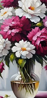 Artistic floral bouquet in a glass vase with vivid pink and white flowers.