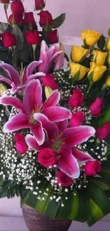 Floral bouquet wallpaper with red roses, yellow roses, and pink lilies.