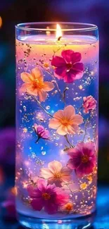 Glowing candle with vibrant flowers and purple tones.