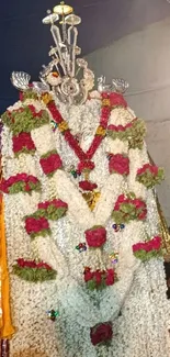 Intricate floral deity garland with vibrant colors.